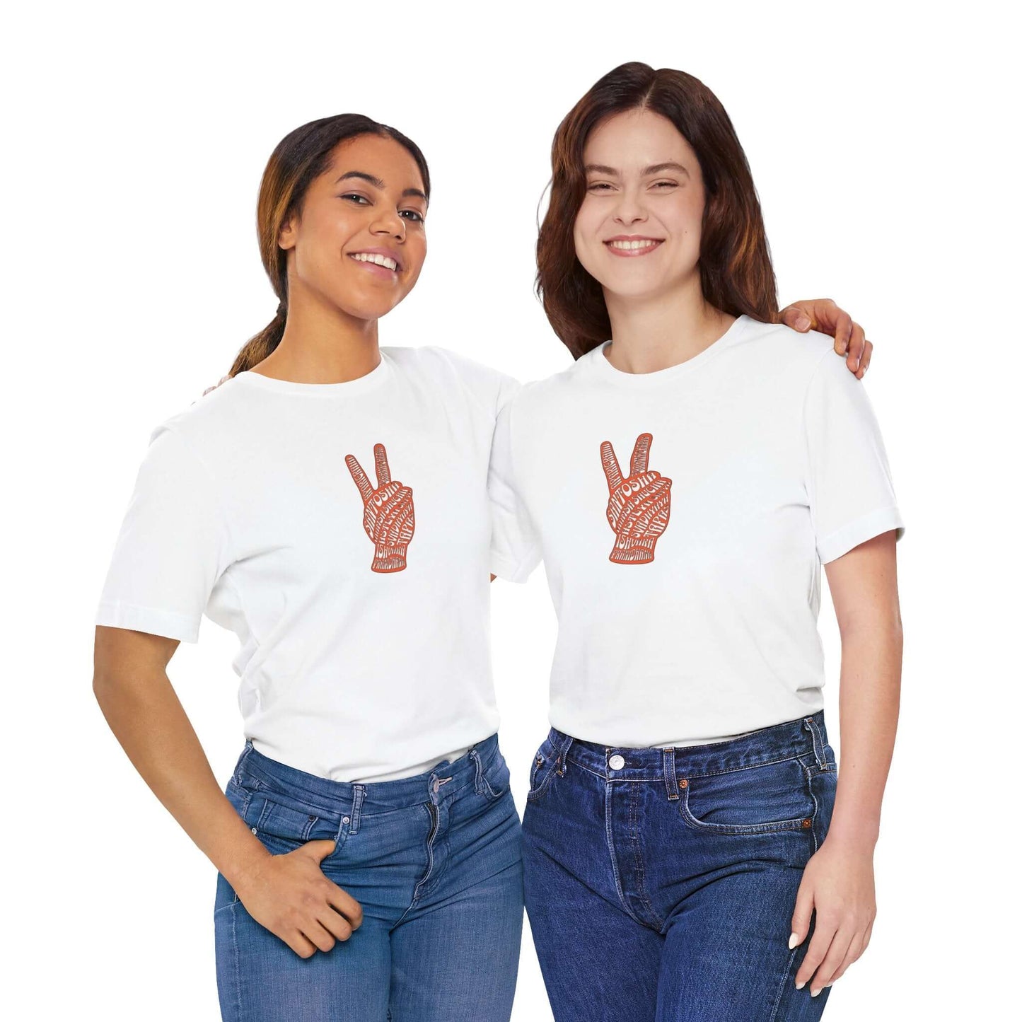 Two women smiling wearing Yamas and Niyamas unisex tees with peace sign design, perfect for yoga and casual wear.