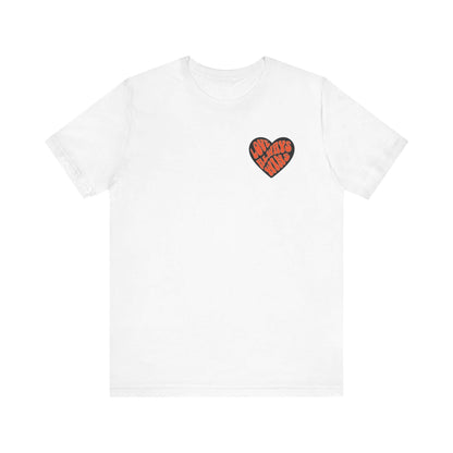 Unisex yoga tee with heart design promoting love and acceptance, made from 100% Airlume combed cotton.