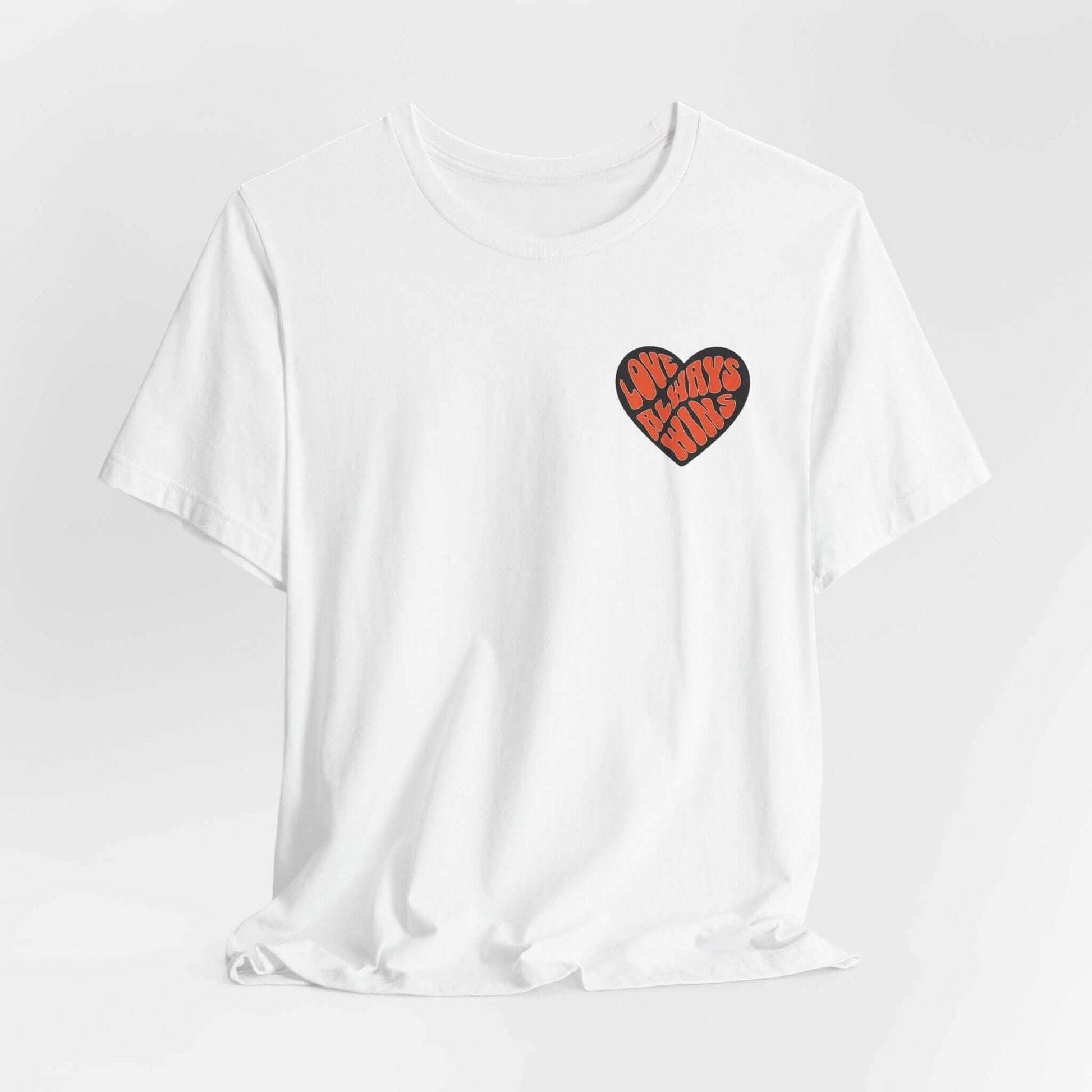 Unisex yoga love tee with heart design on white shirt, 100% cotton, embodies yogic message of love and acceptance.