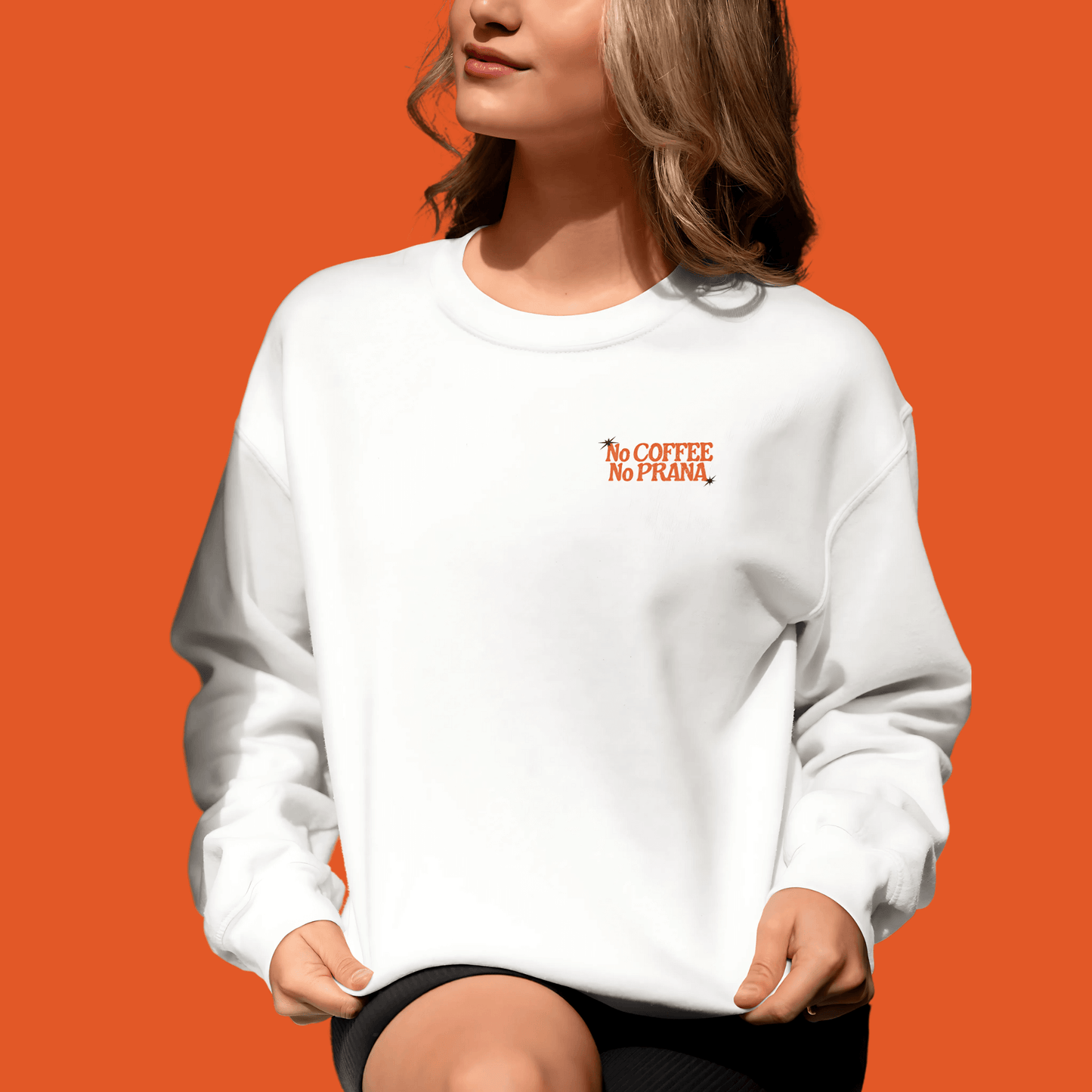 Unisex white sweatshirt with "No Coffee No Prana" text, perfect for yoga and coffee lovers, offering style and comfort.